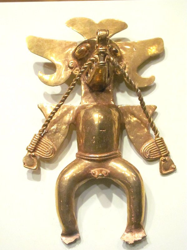 A gold Mayan bird figure