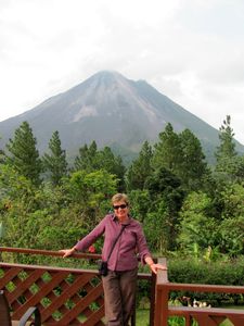 Linny on the balcony at the lodge, with Arenal volcano in the background