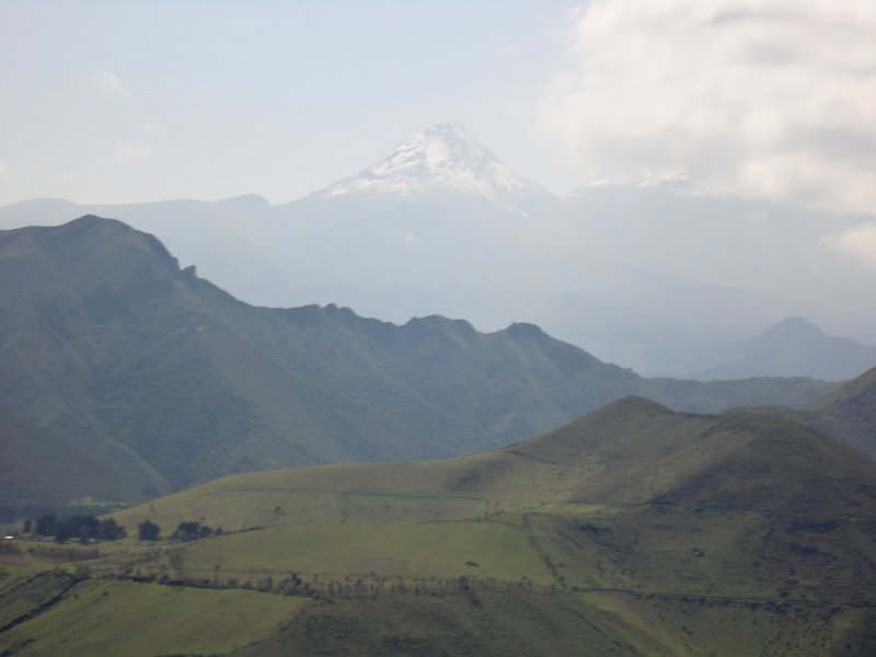 Snow capped peak of Cotopaxi Volcano - second highest in Ecuador - from the back of a truck