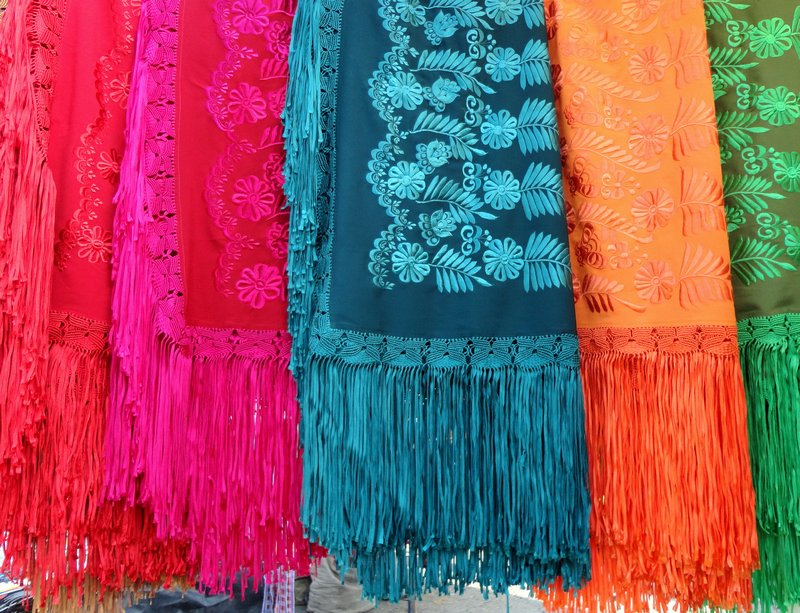 Summer shawls - vibrant colours - they were being worn under woolen shawls the day we were at the market.