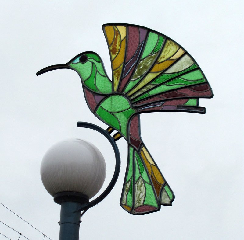 Humming bird glass panel over lamp in Otavalo,