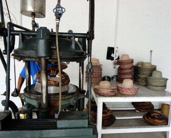 The press used to shape each panama hat individually