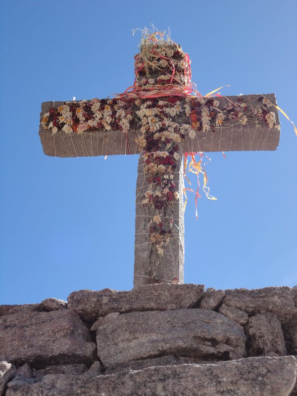 Decorated stone cross overlooking the canyon