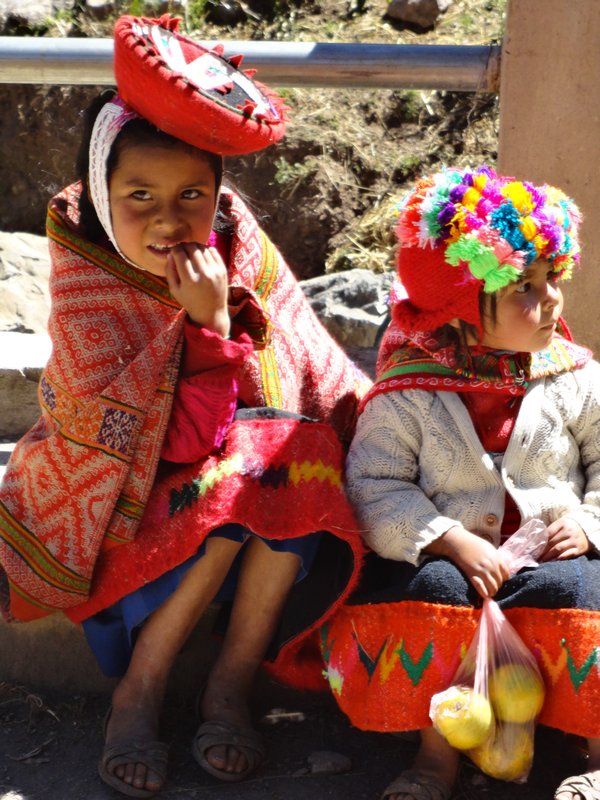 Sisters at the colourful market in Huilloq