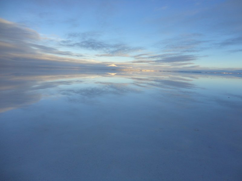 Clouds reflected in the water on the Salar
