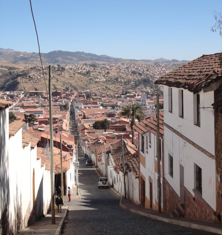 Typical street scape in Sucre - with the bare hills behind the city