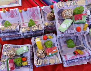 Pretend cash and other sugar miniature items for prayers