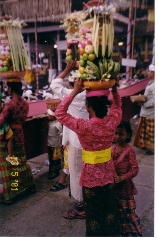 Woman with offering basket on her head, Ubud, Bali