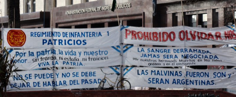 Protest signs in Plaza de Mayo