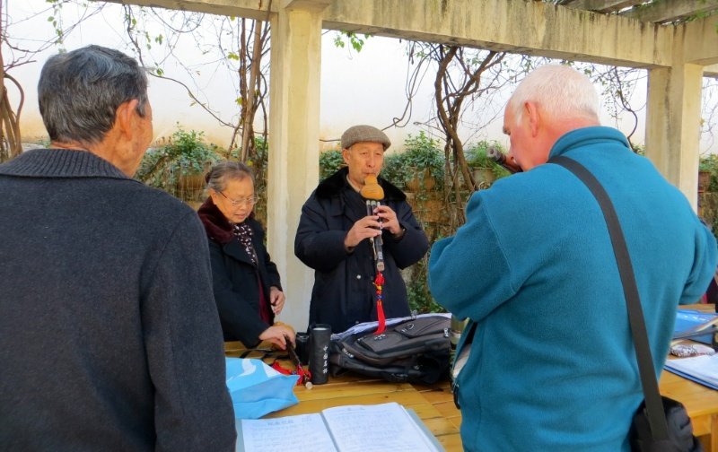Jerry playing music with a group of local musicians