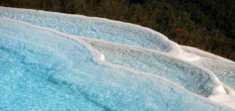 Crystal clear blue waters and icy edges of the terrace pools