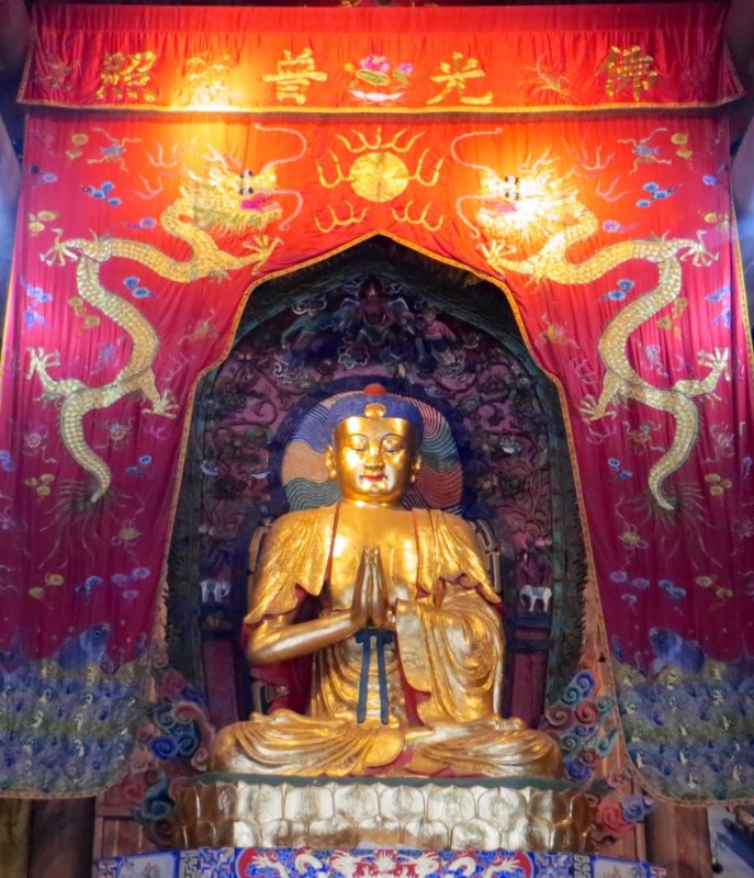 Gilded Buddha within the temple