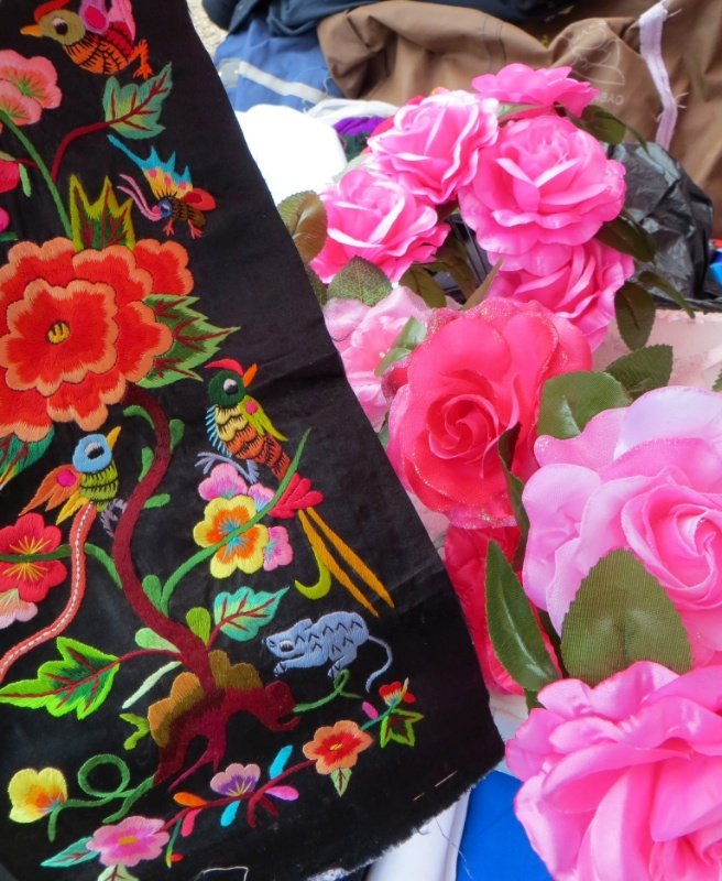 Embroidery panels and artificial pink roses 