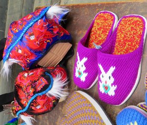 Traditional children's hats and handmade slippers