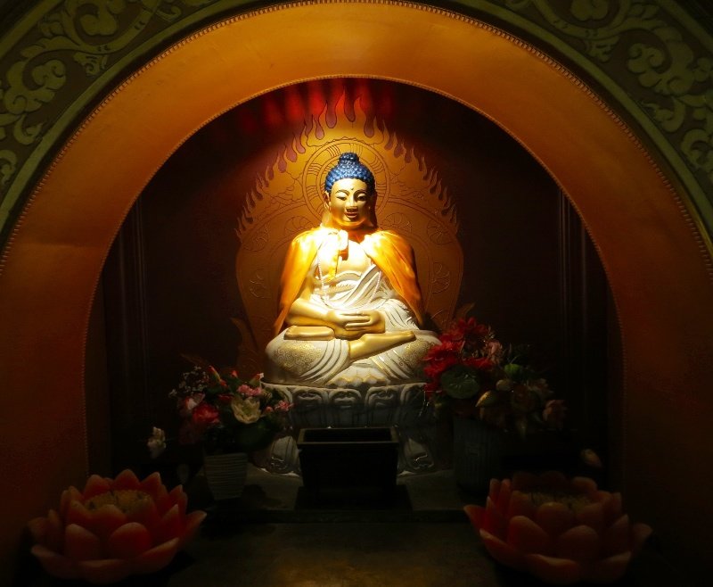Buddha inside the room under the base of the Golden Summit