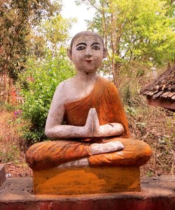 Cheeky faced Buddha statue
