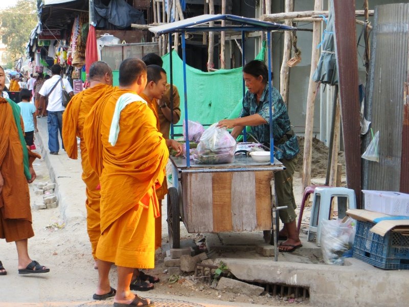 Monks enjoying snack food in Mukdahan