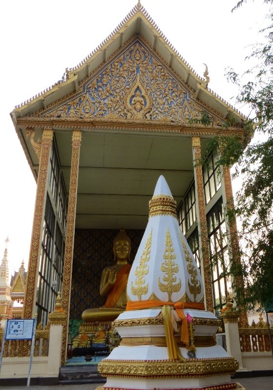 Buddha and stupa in temple grounds in Mukdahan
