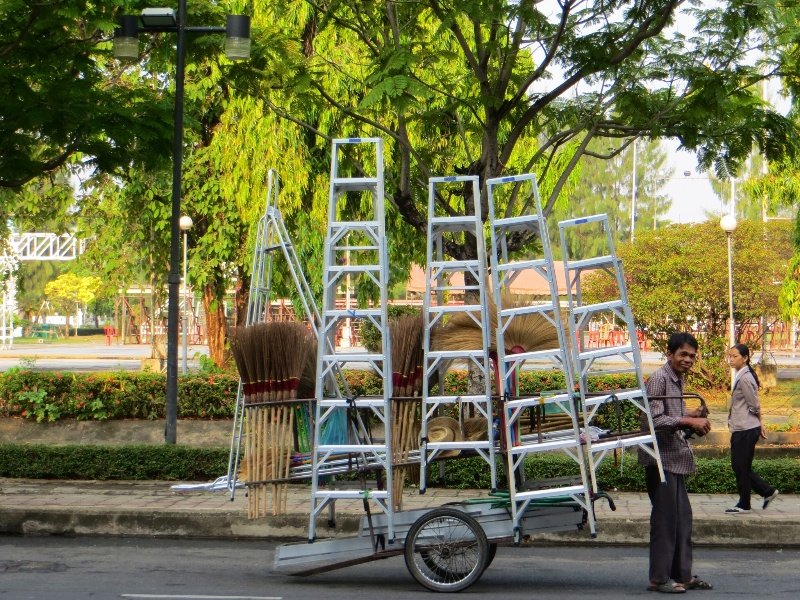 A wave from a man selling ladders in Ubon Ratchathani