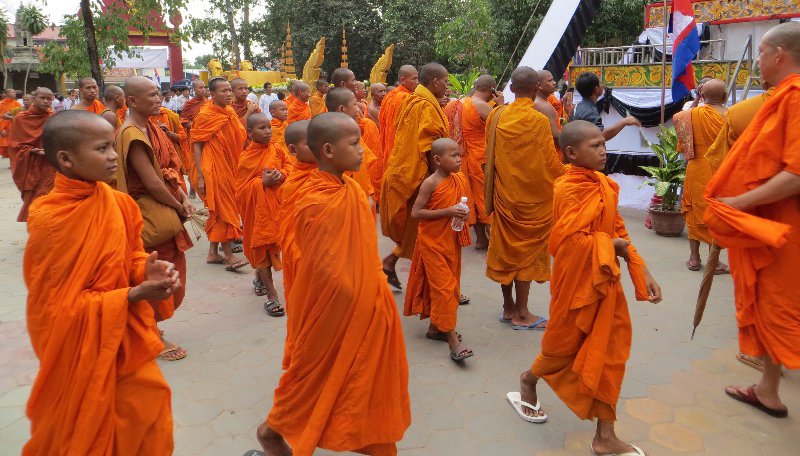 Monks streaming towards the coffin dias for the ceremony
