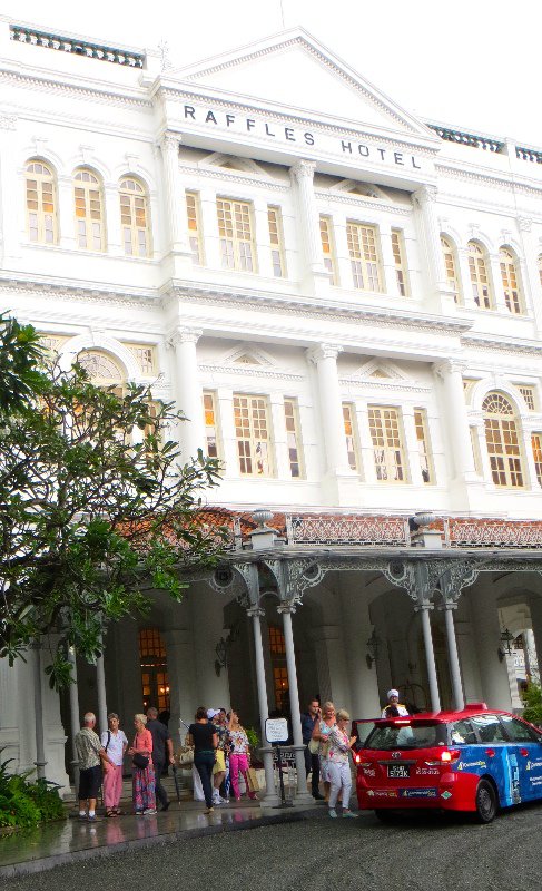 Trying to decide whether we are brave enough to check out Raffles Hotel foyer...