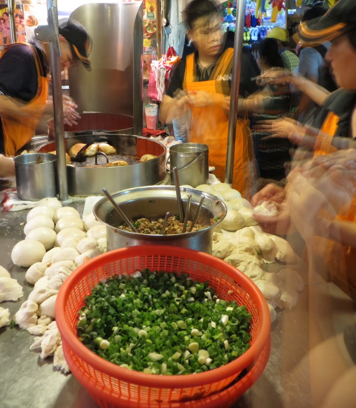 These ladies were making these baked pork buns at an incredible speed. 