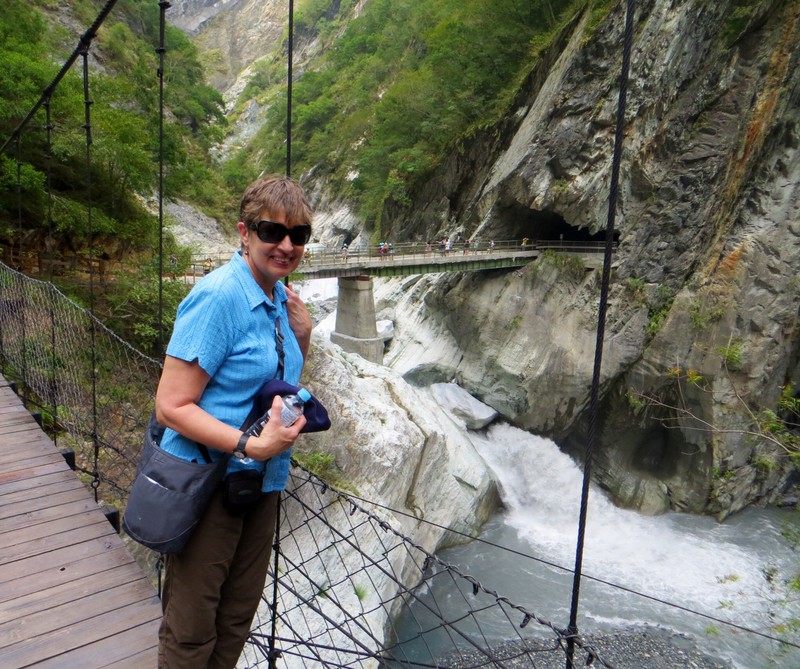 Crossing a suspension bridge on one of the Baiyang Trail.