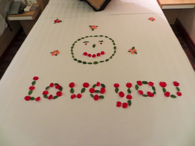 Message written in rose petals on our bed in Hanoi when we arrived back