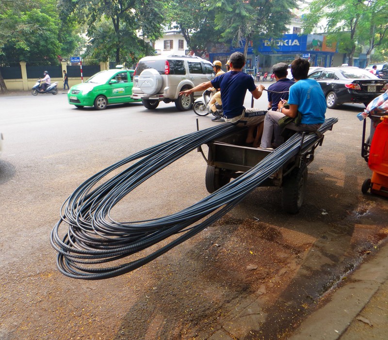 They had just been booked by the police for driving through Hanoi traffic with their load