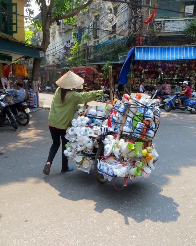One of the many women street sellers - this lady is selling household paper productd