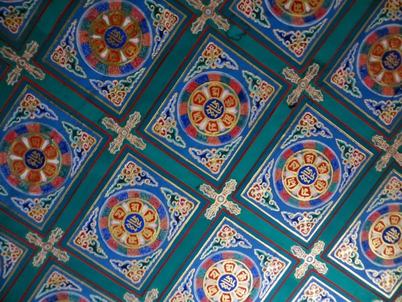 Ceiling decoration within the main temple hall at the Llama Temple
