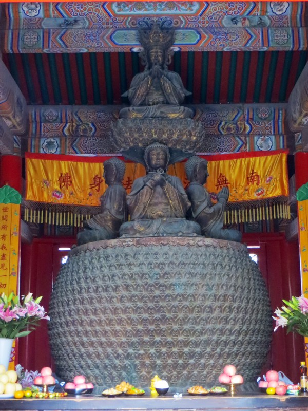 The bronze Buddha atop four smaller Buddhas in the in temple of the Fayuan Temple.