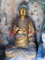 Dusty gilded Buddha in Hanging Monastery