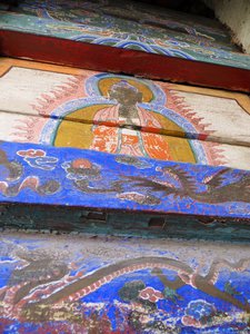 Vivid but flaking paint on the exterior walls of the Hanging Monastery  