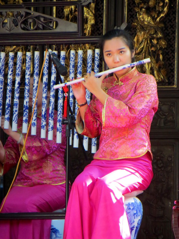 Blue and white porcelain musical instruments being played on the stage at the Yuyuan Gardens