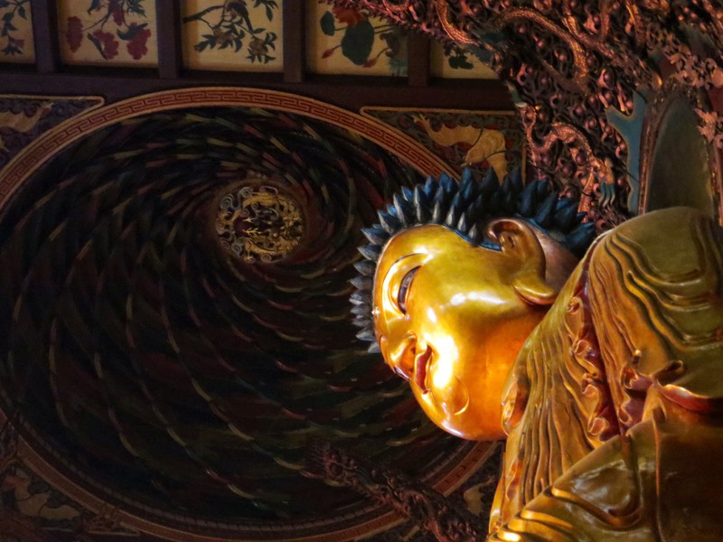Gilt Buddha with domed gilt ceiling above