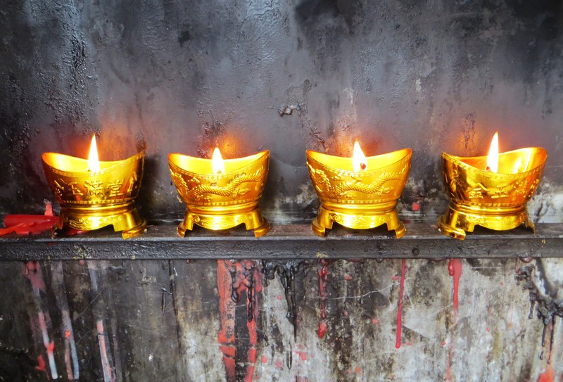 Candles burning within the temple