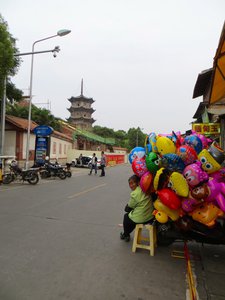 Balloon seller outside the Kaiyuan Temple complex
