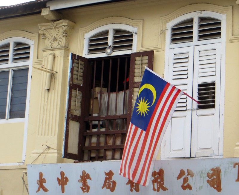 Malaysian flag and shop front