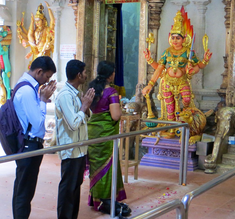 Praying within the Sri Veeramakaliamman Temple.