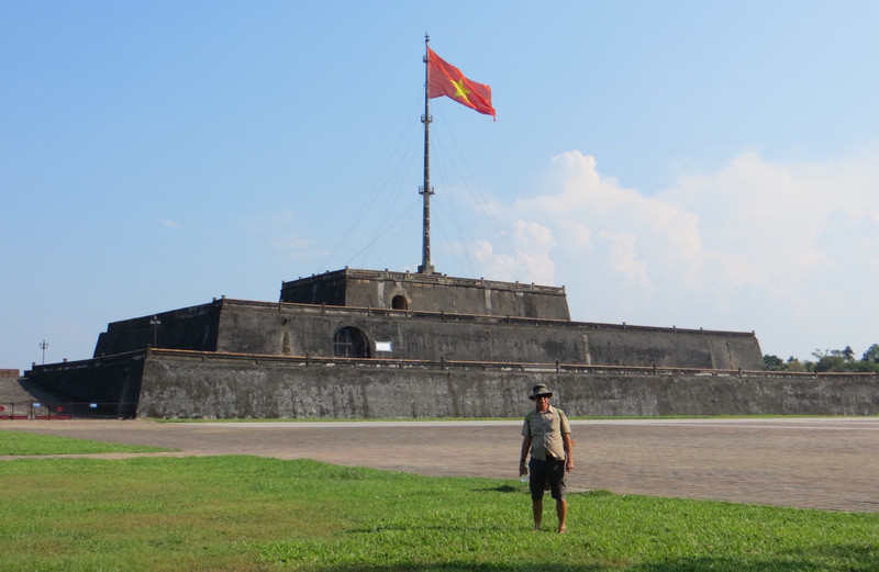 Jerry standing n front of the massive flag tower at the Citadel