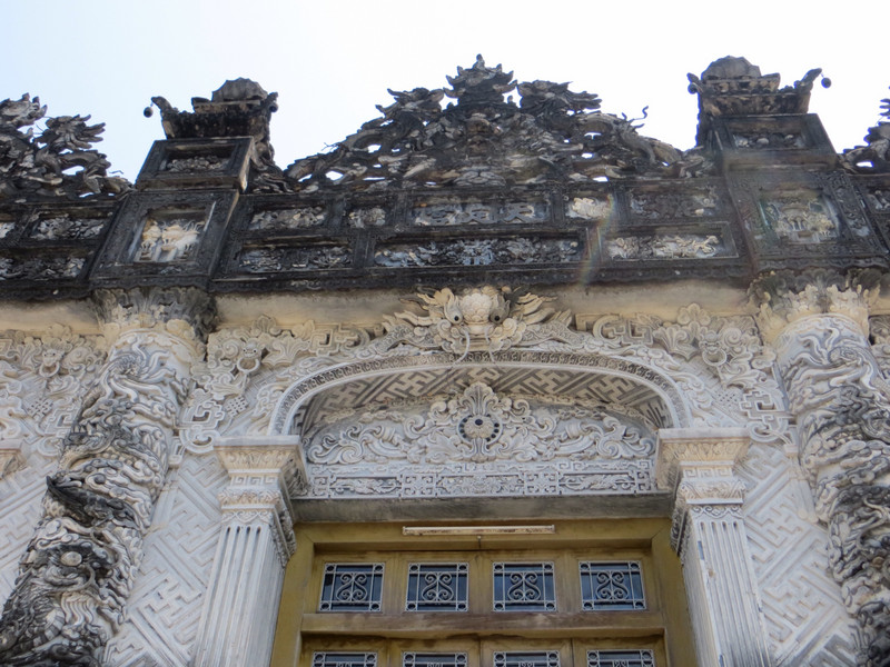 Lovely detailed, though dirty, marble carvings at the entrance of Khai Dinh