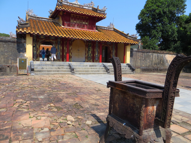An incense burner and small temple at the Tomb of Minh Manh