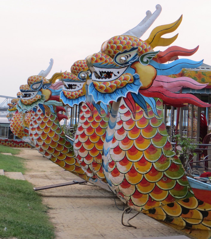 A row of dragons on the river.