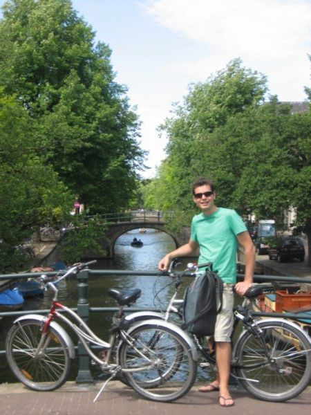 Sam with our bikes, canal-side