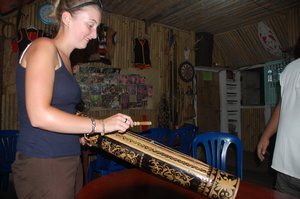 Michelle playing local instrument