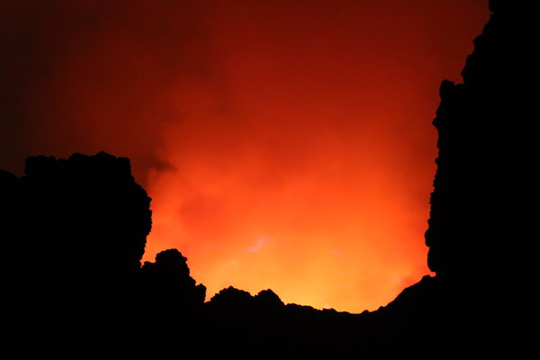 Lava Glowing Between Volcano Rim