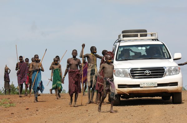 The Vehicle Surrounded By A Tribe