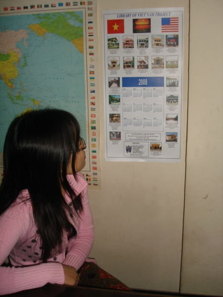 Mrs. Phuong looks at the Vietnam Library Project 