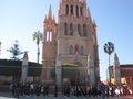 Students practicing a parade in front of the cathedral in San Miguel
